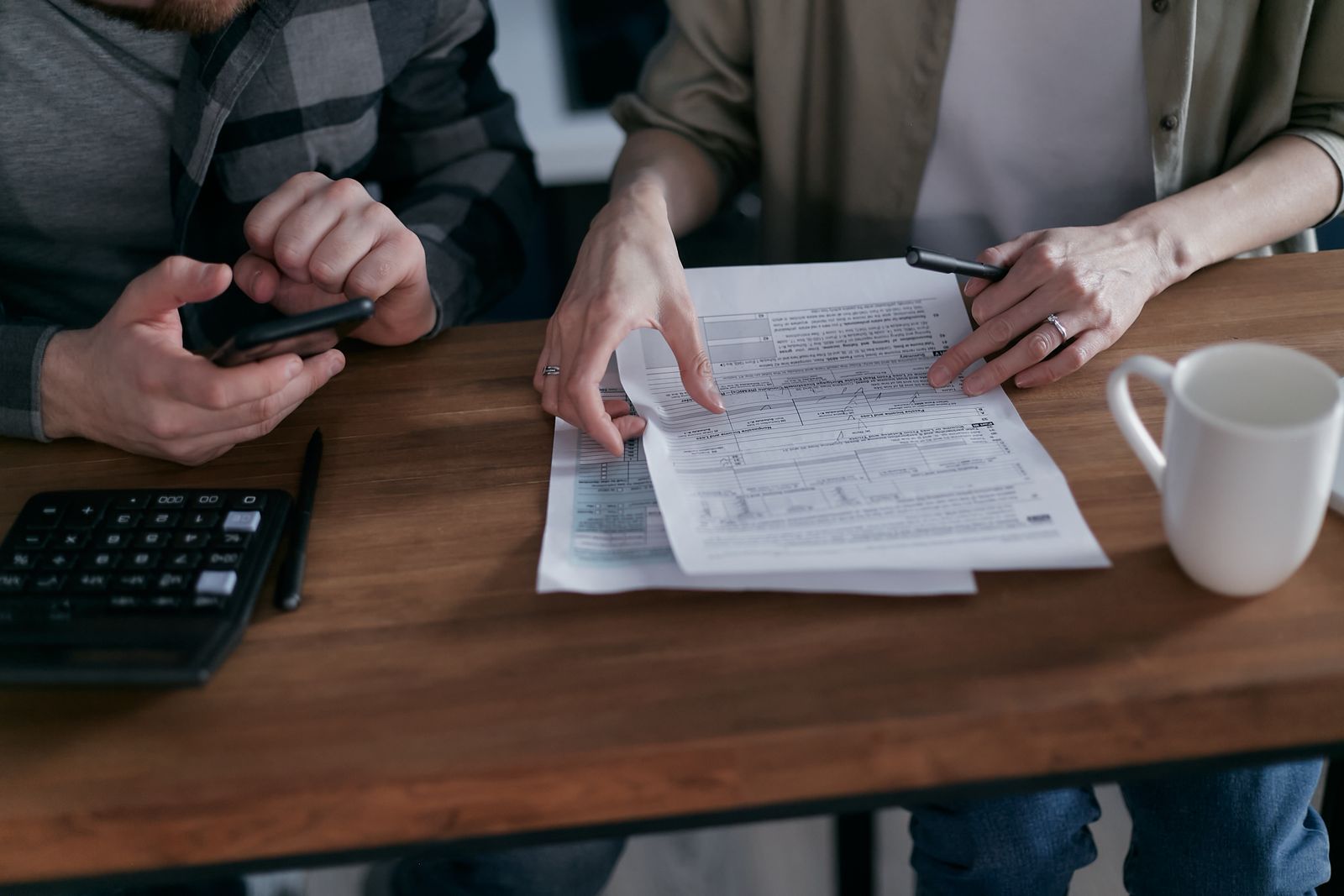 Professionals examining financial documents during an audit review